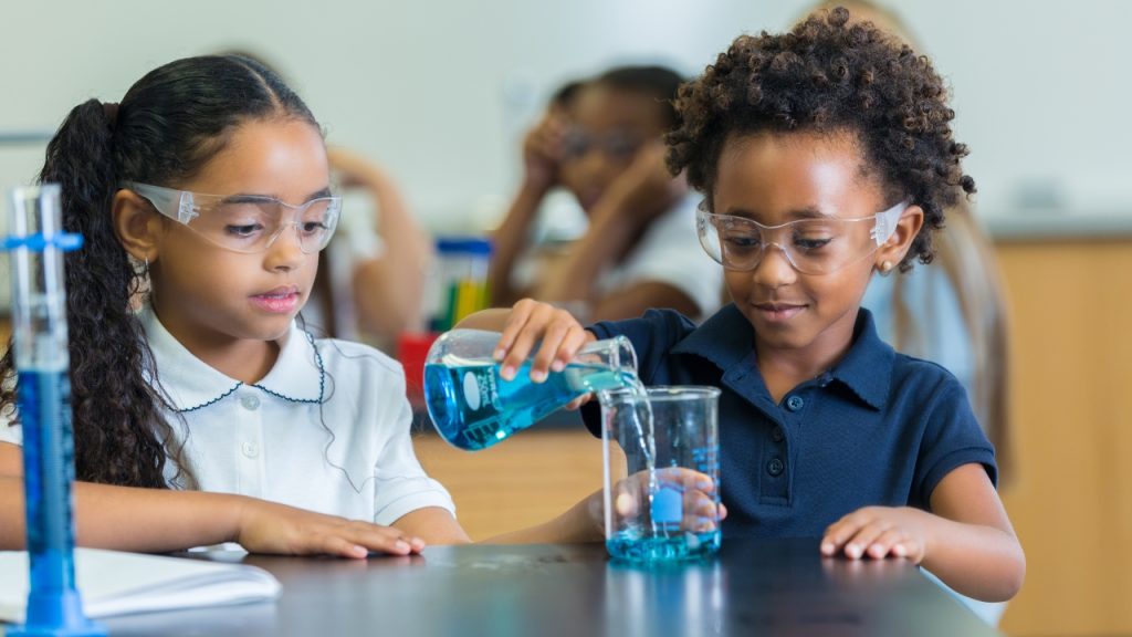 two girls doing a STEM day experiment