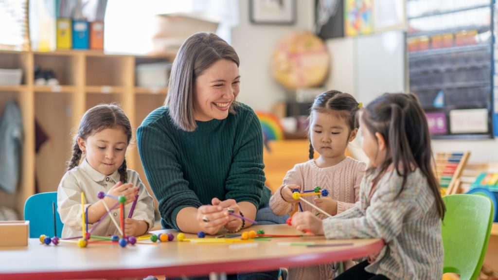 mom helping in the classroom during american education week